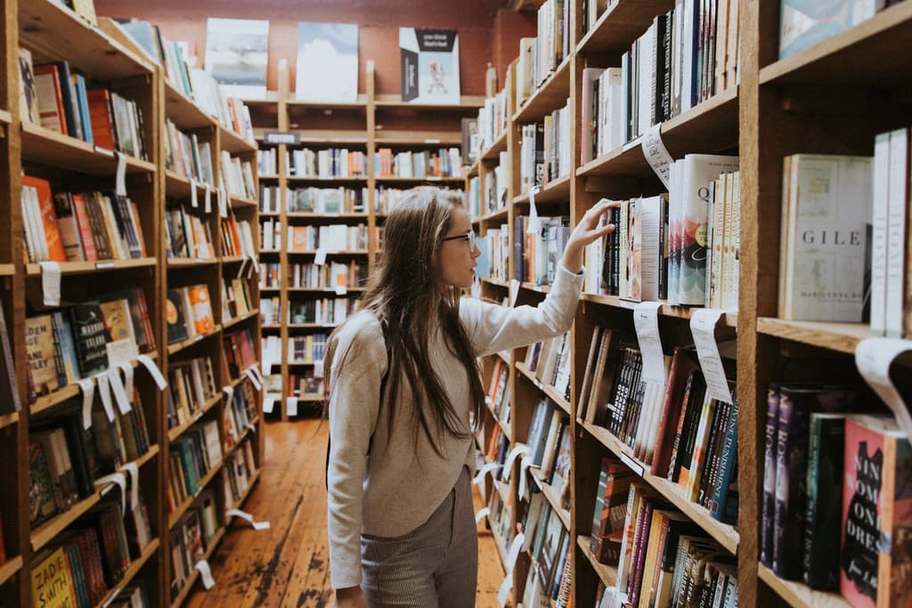 a photo of a women in a library